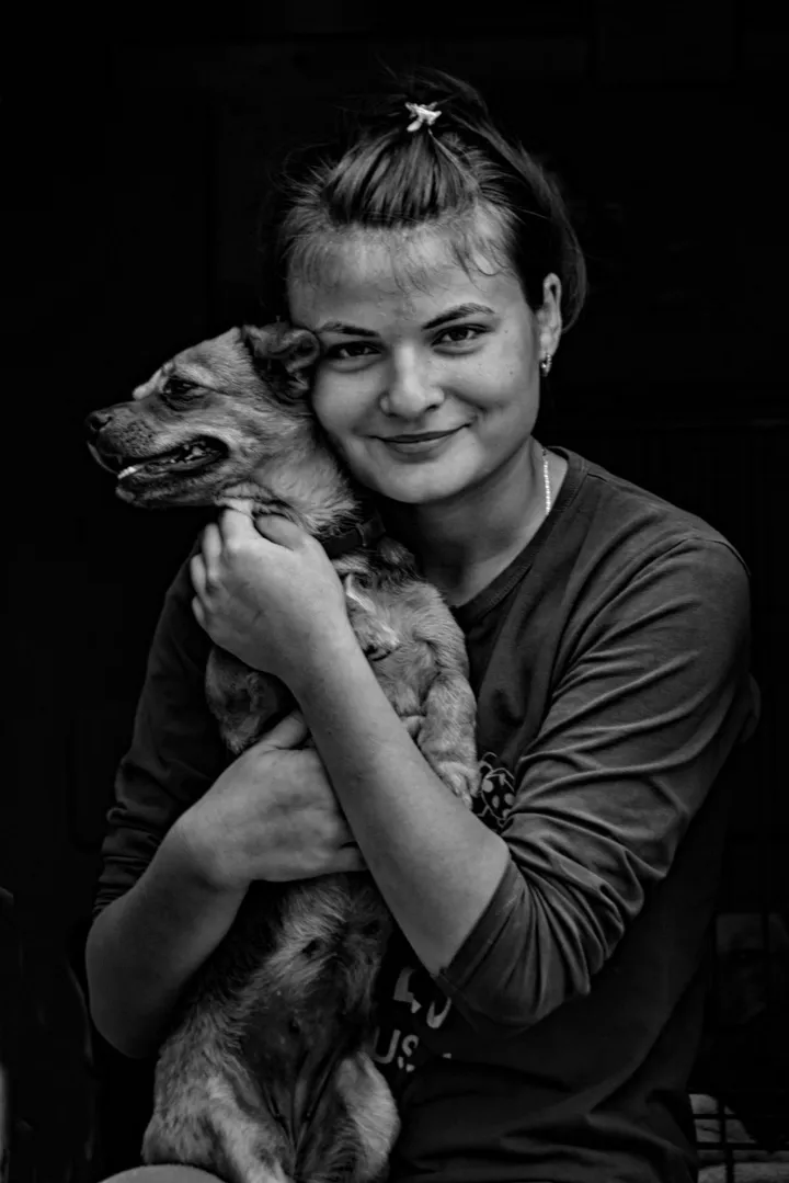 portrait of a young girl with her dog, artwork by Cornel Gingarasu