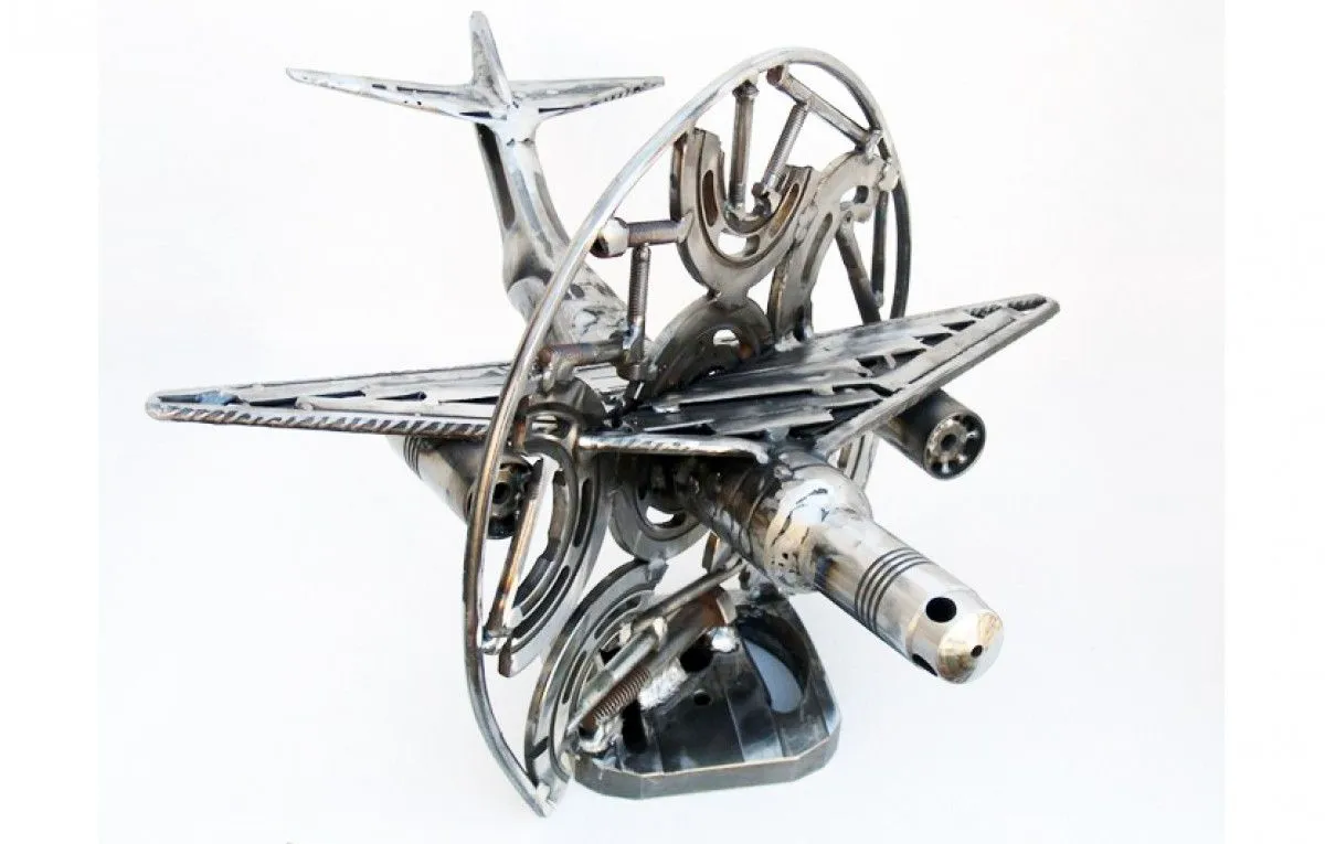 Abstract metal sculpture airplane “parallax”, artwork by Dendrinos gIANNIS